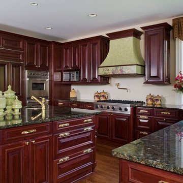 WoodMode Cherry Cabinet Kitchen with Brass Hardware and Stucco Hood