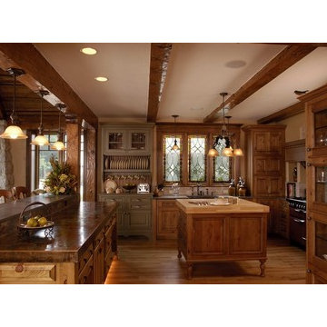 WoodMode Kitchen with Stained Knotty Alder and Painted Green Cabinetry