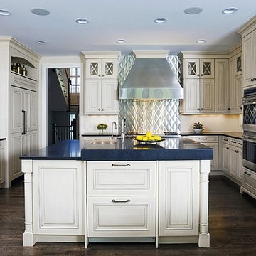 WoodMode Off White Kitchen Cabinetry with Honed Black Absolute Countertops