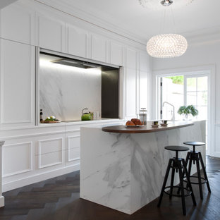 Inspiration for a small transitional galley separate kitchen in Sydney with an undermount sink, raised-panel cabinets, white cabinets, marble benchtops, dark hardwood floors, with island and white benchtop.
