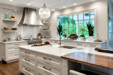 Large transitional l-shaped medium tone wood floor and brown floor eat-in kitchen photo in New York with an undermount sink, beaded inset cabinets, white cabinets, quartzite countertops, gray backsplash, stone slab backsplash, stainless steel appliances, an island and gray countertops