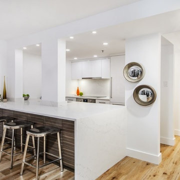 Yaletown Condo with Kitchen Pillars and Fireplace Wall