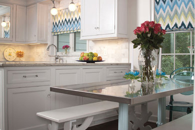 Example of a transitional eat-in kitchen design in Cleveland with beaded inset cabinets, white cabinets, white backsplash and stone tile backsplash