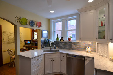 Mid-sized transitional l-shaped eat-in kitchen photo in St Louis with an undermount sink, shaker cabinets, white cabinets, quartz countertops, blue backsplash, subway tile backsplash, stainless steel appliances, no island and white countertops