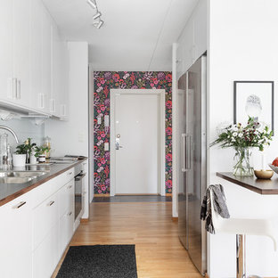 Modern single-wall kitchen in Gothenburg with flat-panel cabinets.