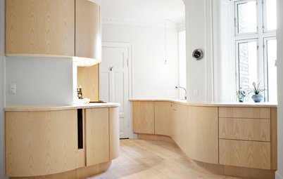 Curves Wind Through a Natural Wood Kitchen