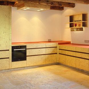 Mid-sized contemporary l-shaped eat-in kitchen with a single-bowl sink, beaded inset cabinets, beige cabinets, wood benchtops, white splashback, stone slab splashback, stainless steel appliances, brick floors, no island, beige floor and orange benchtop.