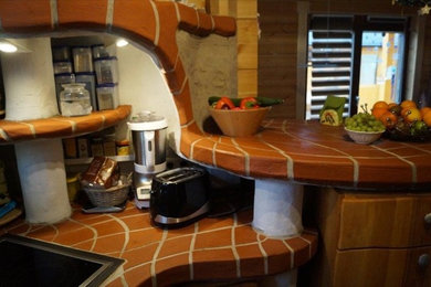シュトゥットガルトにあるラスティックスタイルのおしゃれなキッチンの写真