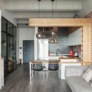 Design ideas for an industrial u-shaped open plan kitchen in Moscow with a drop-in sink, white cabinets, wood benchtops, metallic splashback, metal splashback, a peninsula, flat-panel cabinets and dark hardwood floors.