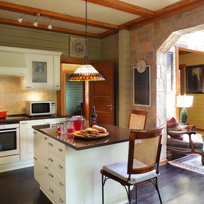 Open concept kitchen - large cottage l-shaped dark wood floor and brown floor open concept kitchen idea in Moscow with raised-panel cabinets, white cabinets, quartzite countertops, beige backsplash, ceramic backsplash, an island and white appliances