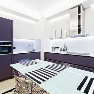 Photo of a mid-sized contemporary l-shaped eat-in kitchen in Saint Petersburg with flat-panel cabinets, white splashback, black appliances and no island.