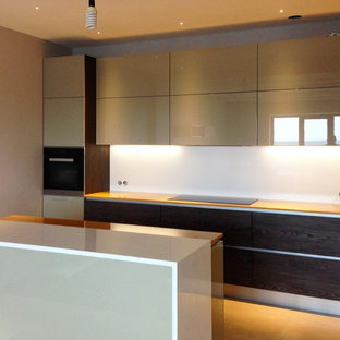 Design ideas for a large modern u-shaped eat-in kitchen in Other with a double-bowl sink, flat-panel cabinets, solid surface benchtops, white splashback, porcelain floors, with island, beige floor, beige cabinets, glass sheet splashback, black appliances and yellow benchtop.