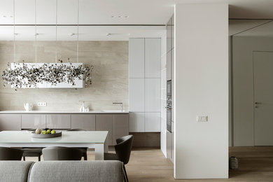 Contemporary kitchen in Moscow with a feature wall.