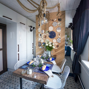Photo of a small beach style separate kitchen in Moscow with ceramic floors and no island.