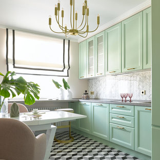 Design ideas for a transitional separate kitchen in Moscow with recessed-panel cabinets, green cabinets, grey splashback, no island, grey floor and grey benchtop.