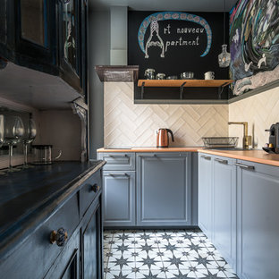 Transitional l-shaped kitchen in Saint Petersburg with a drop-in sink, raised-panel cabinets, grey cabinets, beige splashback, multi-coloured floor and orange benchtop.