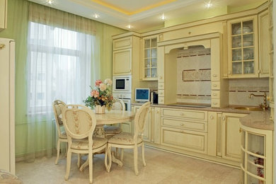 Design ideas for a large classic l-shaped kitchen/diner in Moscow with a submerged sink, raised-panel cabinets, beige cabinets, marble worktops, white splashback, ceramic splashback, white appliances and marble flooring.