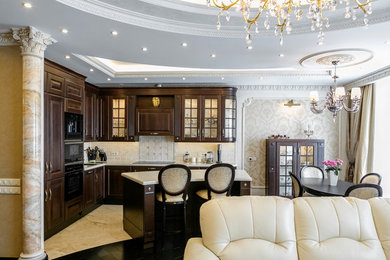Large traditional l-shaped kitchen/diner in Moscow with a submerged sink, composite countertops, beige splashback, black appliances, an island, raised-panel cabinets, dark wood cabinets, ceramic splashback, porcelain flooring, beige floors and beige worktops.
