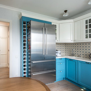 Inspiration for a transitional kitchen in Moscow with an integrated sink, recessed-panel cabinets, blue cabinets and grey splashback.