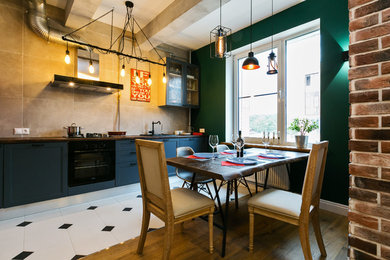 Industrial single-wall kitchen/diner in Moscow with shaker cabinets, blue cabinets, beige splashback, black appliances, no island and white floors.