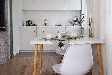 Свежая идея для дизайна: кухня среднего размера в скандинавском стиле с паркетным полом среднего тона - отличное фото интерьера