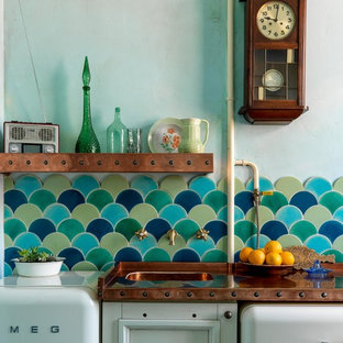 Small eclectic single-wall eat-in kitchen in Moscow with a single-bowl sink, recessed-panel cabinets, white cabinets, copper benchtops, multi-coloured splashback, ceramic splashback, white appliances, ceramic floors, multi-coloured floor and orange benchtop.