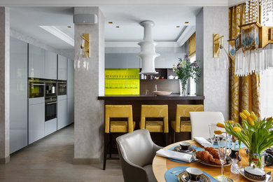 Photo of a contemporary kitchen in London with black appliances.