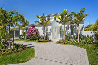 Design ideas for a large tropical full sun front yard concrete paver driveway in Other for summer.