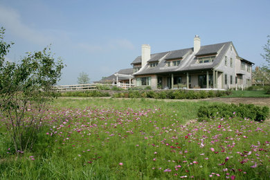 Large rustic back full sun garden in New York.