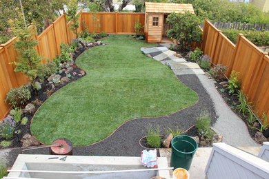 Design ideas for a large contemporary back partial sun garden in San Francisco with gravel.