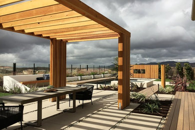 Design ideas for a contemporary drought-tolerant and full sun backyard concrete paver landscaping in San Diego.