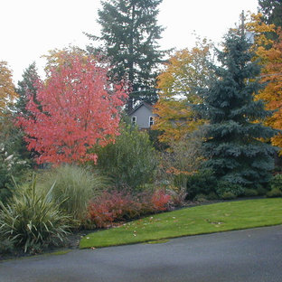 Inspiration for a large contemporary full sun front yard driveway in Portland for fall.