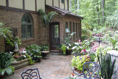 A garden where the sunroom tropicals can grow in the summer