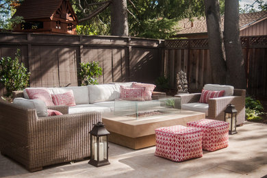 Inspiration for a transitional backyard stone patio remodel in San Francisco with a fire pit