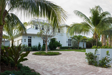 Inspiration for a large coastal front yard landscaping in Miami.
