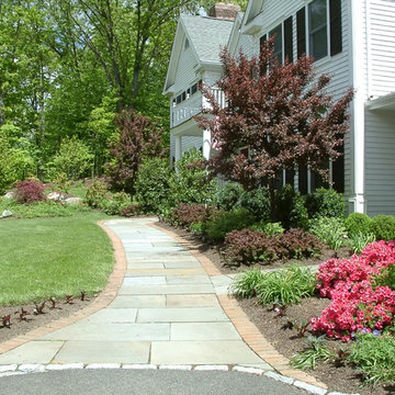 A new brick edge widens an existing bluestone walk