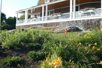 This is an example of a large coastal backyard landscaping in Portland Maine.