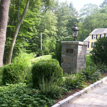 A stone pier and stone apron adds formality