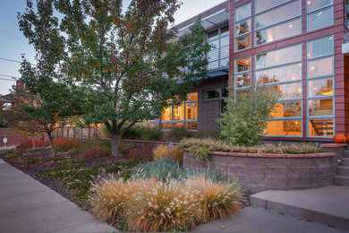 Design ideas for a mid-sized contemporary partial sun front yard landscaping in Denver for fall.