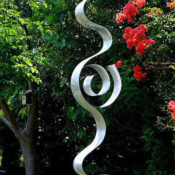 Abstract Silver Metal Garden Sculpture - Looking Forward by Jon Allen