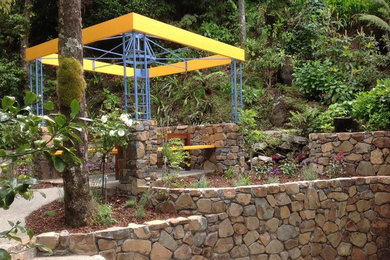 After construction of walling, paths, sitting area and steel pergola