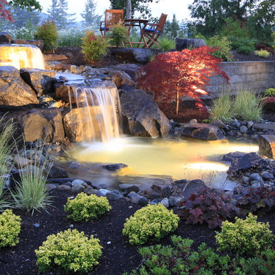This is an example of a traditional backyard river rock waterfall in Seattle.