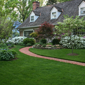 An Entry with a Beautiful Lawn and Colorful Garden
