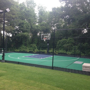 Andover Backyard Basketball Court with rebounder and lighting