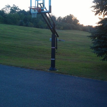Andy W's Pro Dunk Bronze Basketball System on a 50x30 in Stratham, NH