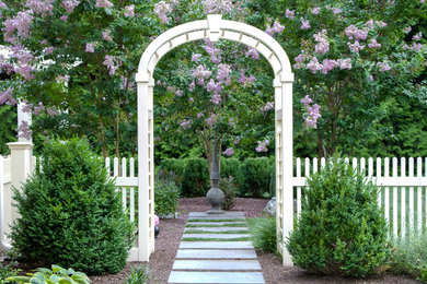 This is an example of a classic back garden for summer in Philadelphia with a garden path.