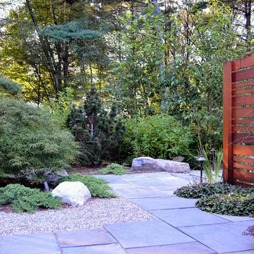 Asian viewing garden privacy screen and bluestone garden walkway.
