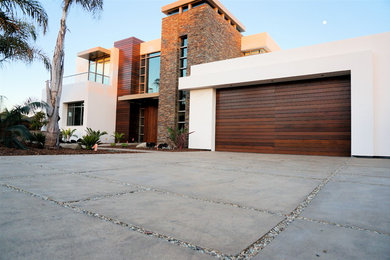 Photo of a mid-sized modern full sun front yard concrete paver driveway in Santa Barbara.