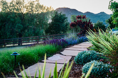 This is an example of a large mediterranean drought-tolerant and full sun front yard stone garden path in San Luis Obispo.