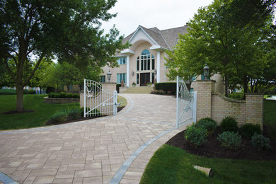Photo of a medium sized contemporary courtyard driveway garden in Chicago with brick paving.